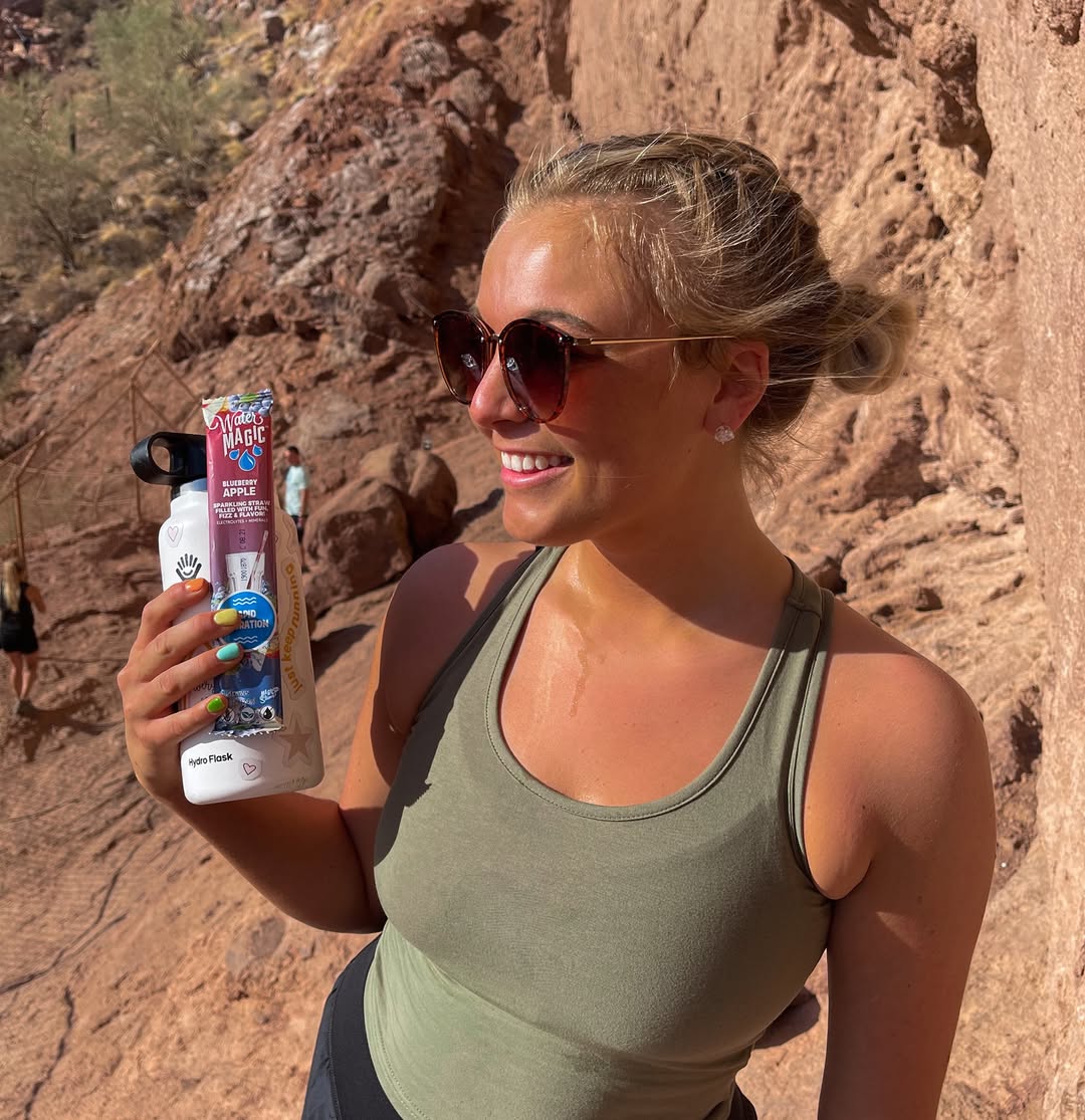 Woman enjoying Water Magic straw outdoors